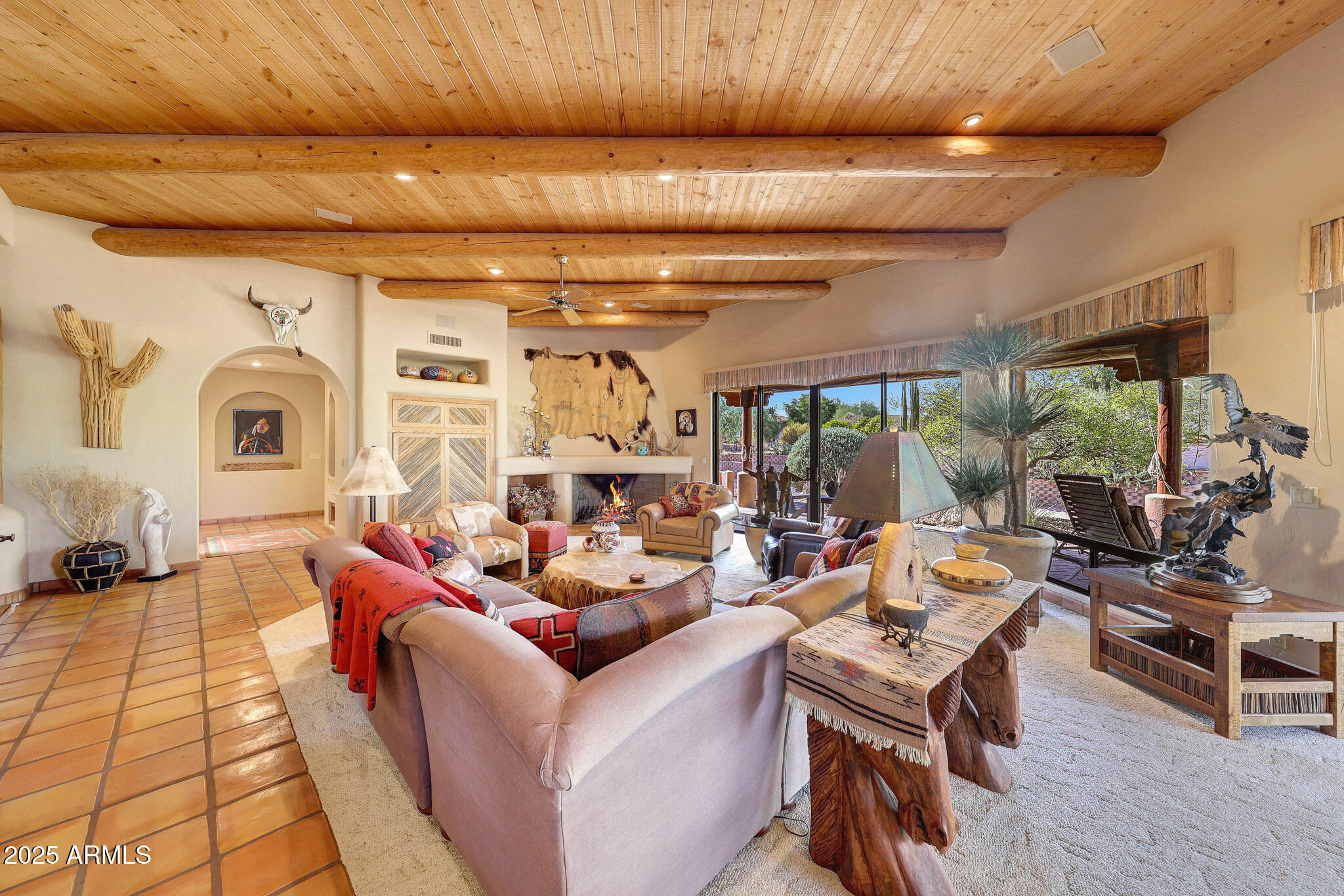 18610 East Gemmill Drive Rio Verde, AZ 85263 - Photo 37 of 65 a living room with fireplace furniture and a large window