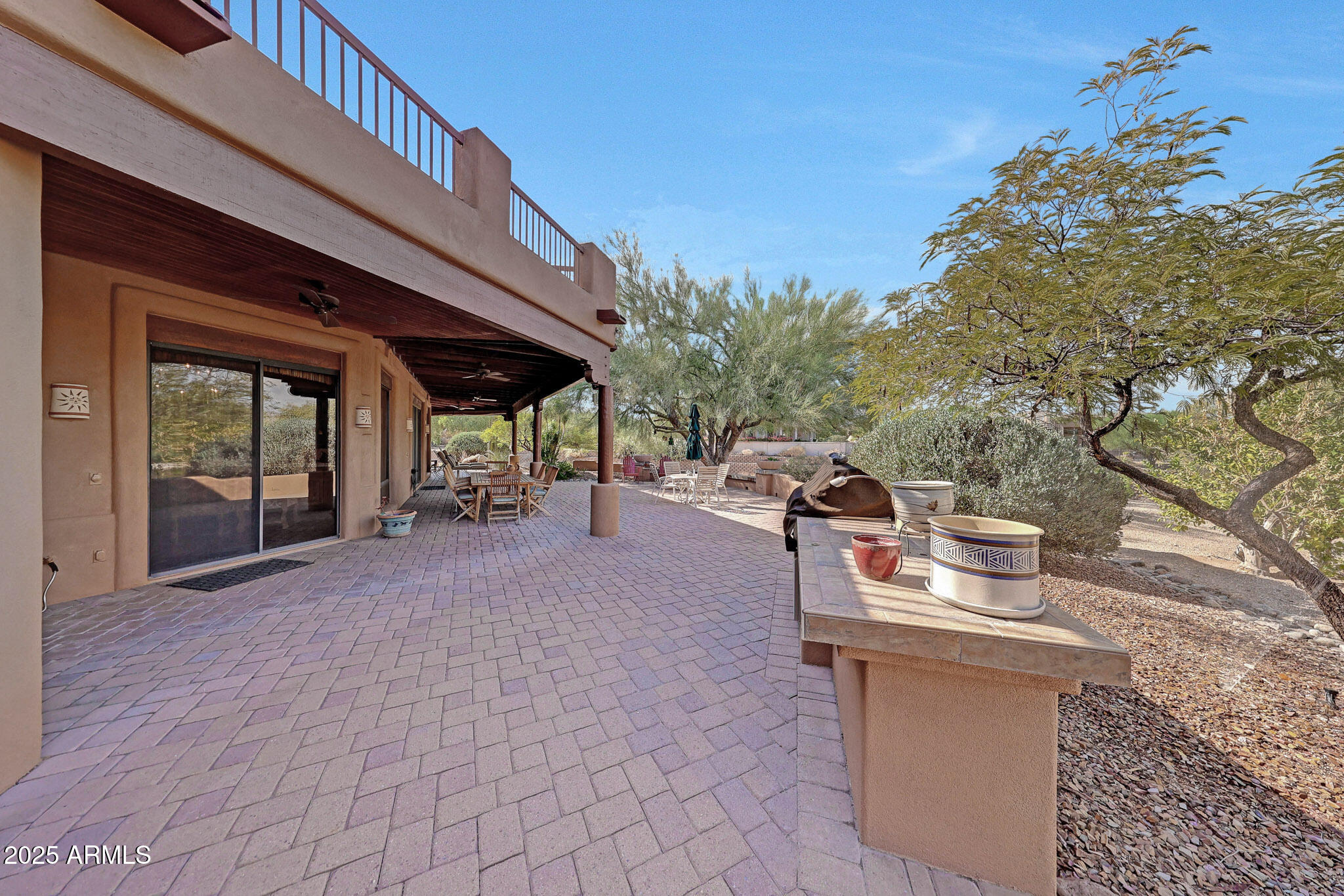 18610 East Gemmill Drive Rio Verde, AZ 85263 - Photo 38 of 53 a view of a patio with table and chairs and potted plants