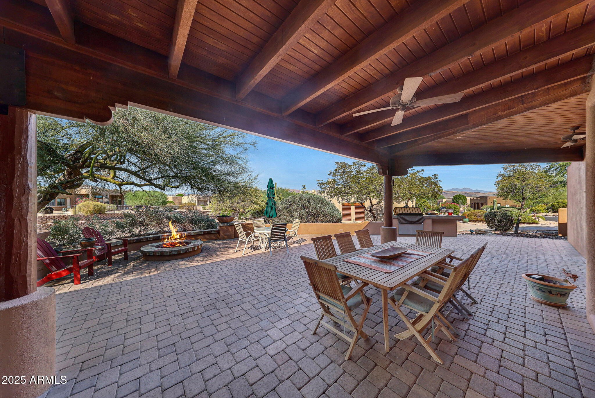18610 East Gemmill Drive Rio Verde, AZ 85263 - Photo 48 of 65 a view of a patio with table and chairs and potted plants
