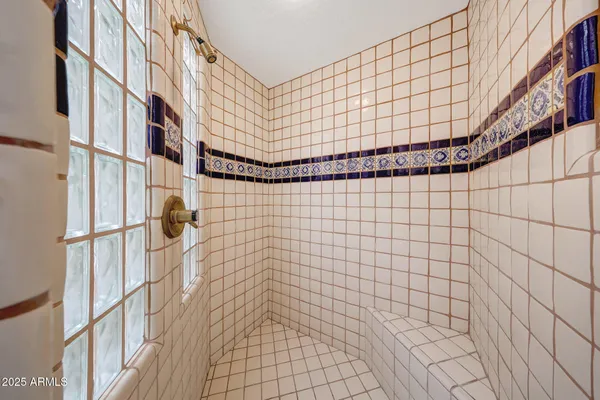 a view of a patio with dining table and chairs