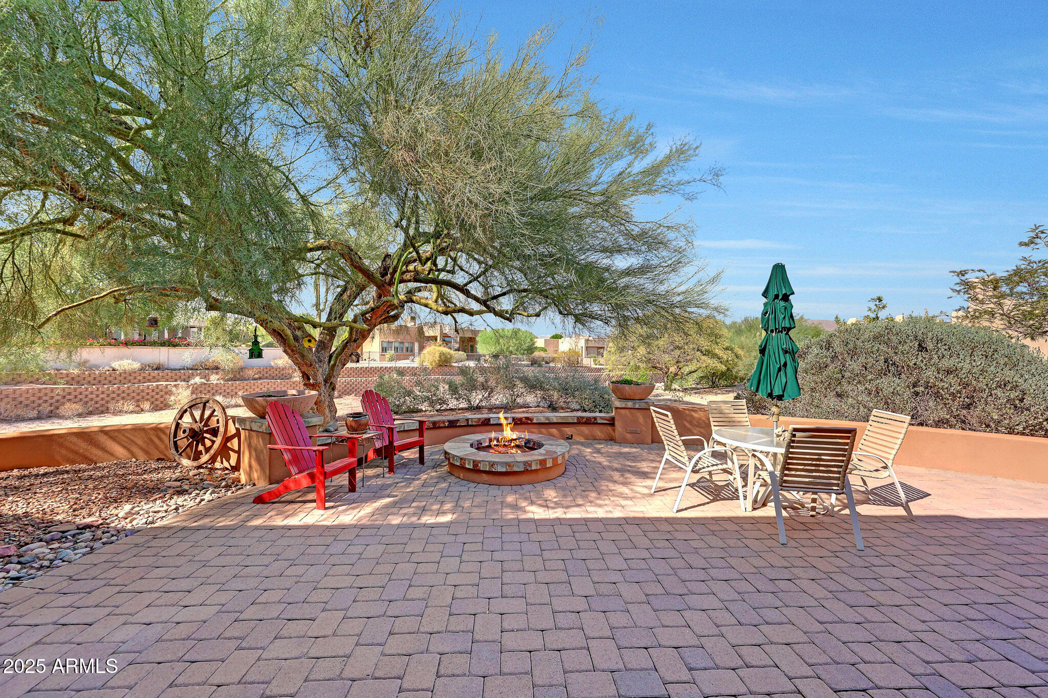 18610 East Gemmill Drive Rio Verde, AZ 85263 - Photo 64 of 65 a view of a patio with table and chairs and potted plants