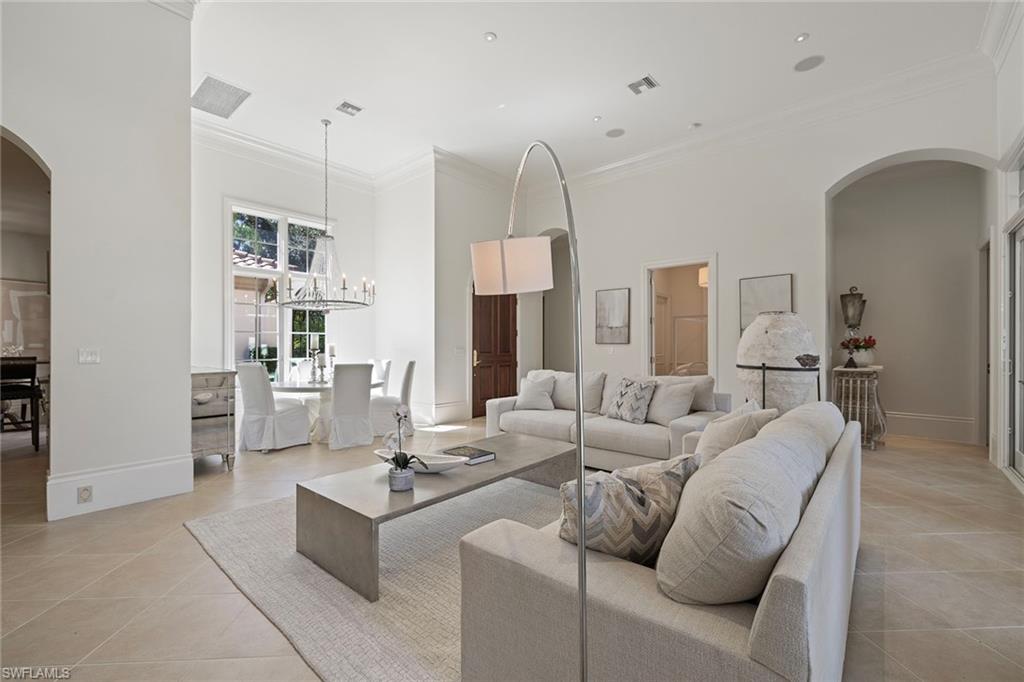 15655 Villoresi Way Naples, FL 34110 - Photo 16 of 47 a living room with furniture and a chandelier