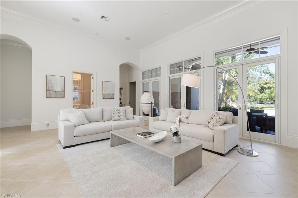 15655 Villoresi Way Naples, FL 34110 - Photo 2 of 47 a living room with furniture and a large window
