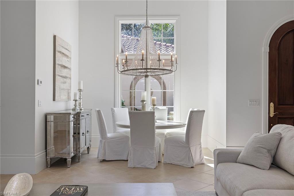 15655 Villoresi Way Naples, FL 34110 - Photo 3 of 47 a view of a dining room with furniture