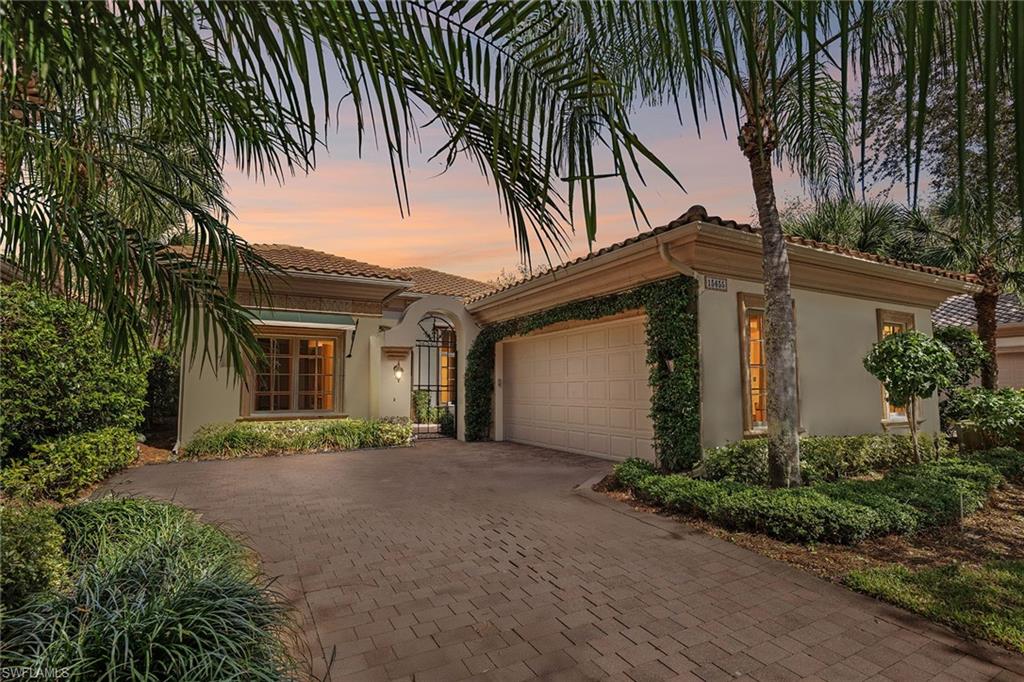 15655 Villoresi Way Naples, FL 34110 - Photo 37 of 47 a front view of a house with a garden