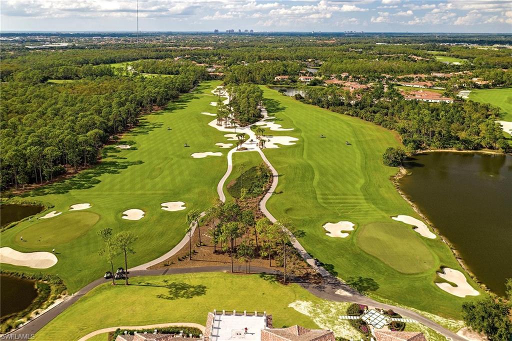 15655 Villoresi Way Naples, FL 34110 - Photo 45 of 47 a view of a swimming pool with a lake view