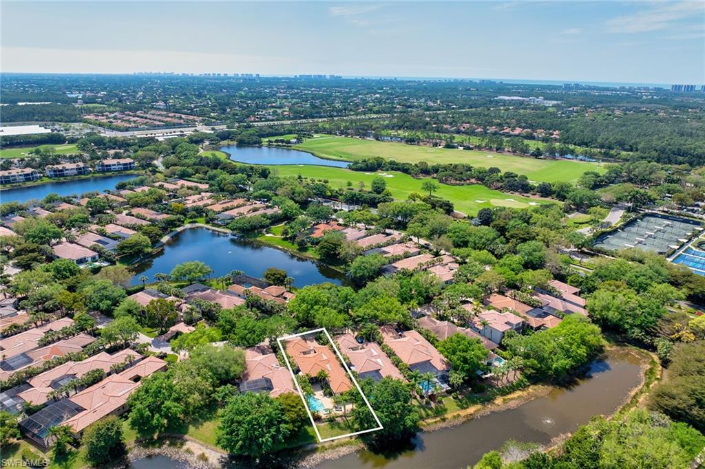 15655 Villoresi Way Naples, FL 34110 - Photo 6 of 47 an aerial view of residential houses with outdoor space and trees