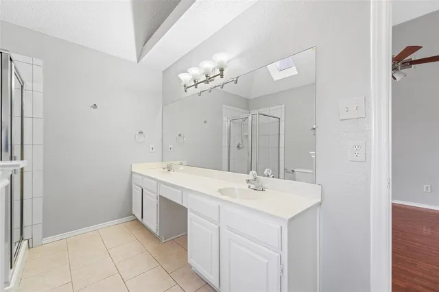 a view of bathroom with a sink mirror and
