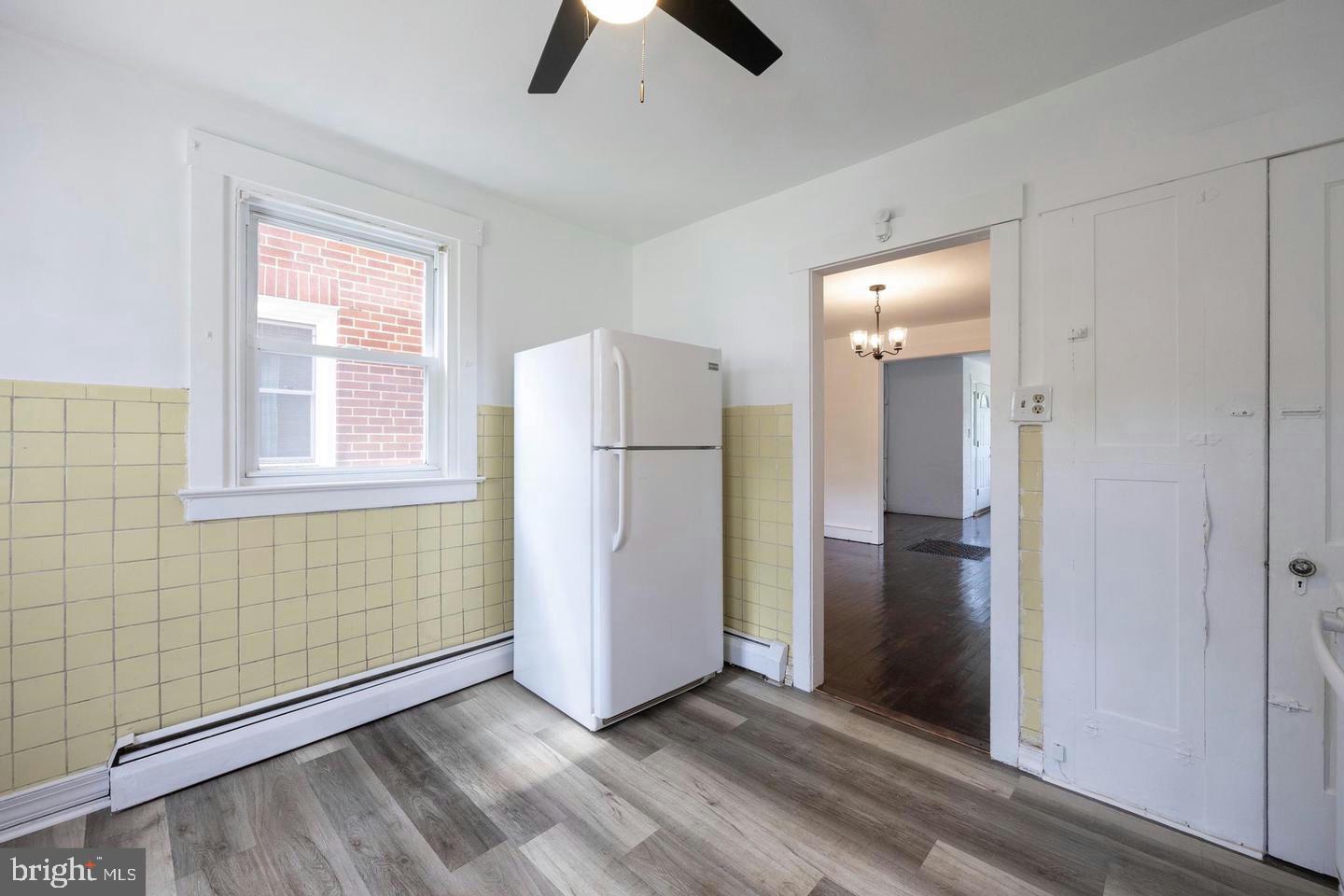 337 Stuart Avenue Downingtown, PA 19335 - Photo 11 of 19 a view of empty room with window and refrigerator