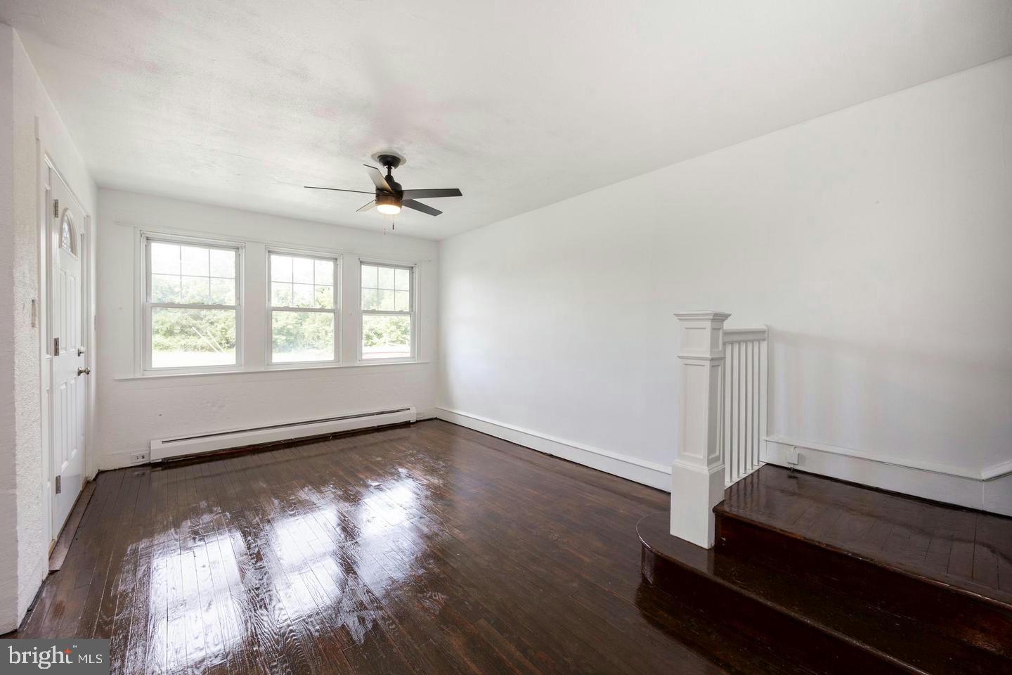 337 Stuart Avenue Downingtown, PA 19335 - Photo 5 of 19 wooden floor in an empty room with a window