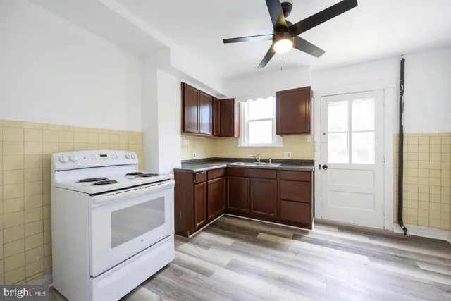 a kitchen with a stove and a microwave