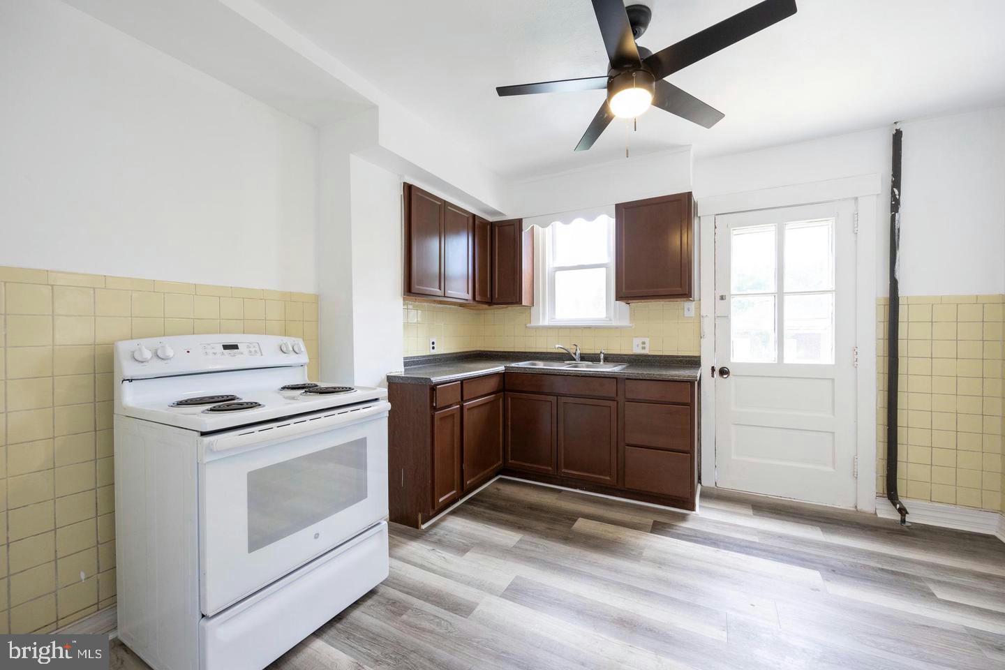 337 Stuart Avenue Downingtown, PA 19335 - Photo 8 of 19 a kitchen with a stove and a microwave