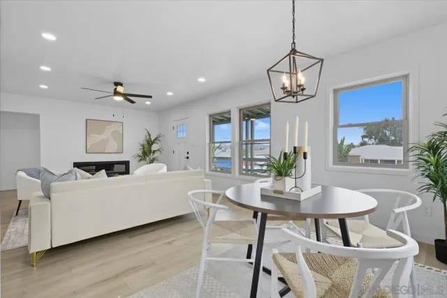 a kitchen with stainless steel appliances a stove a refrigerator a sink a counter space and cabinets