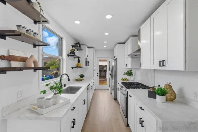 a kitchen with stainless steel appliances kitchen island microwave and cabinets
