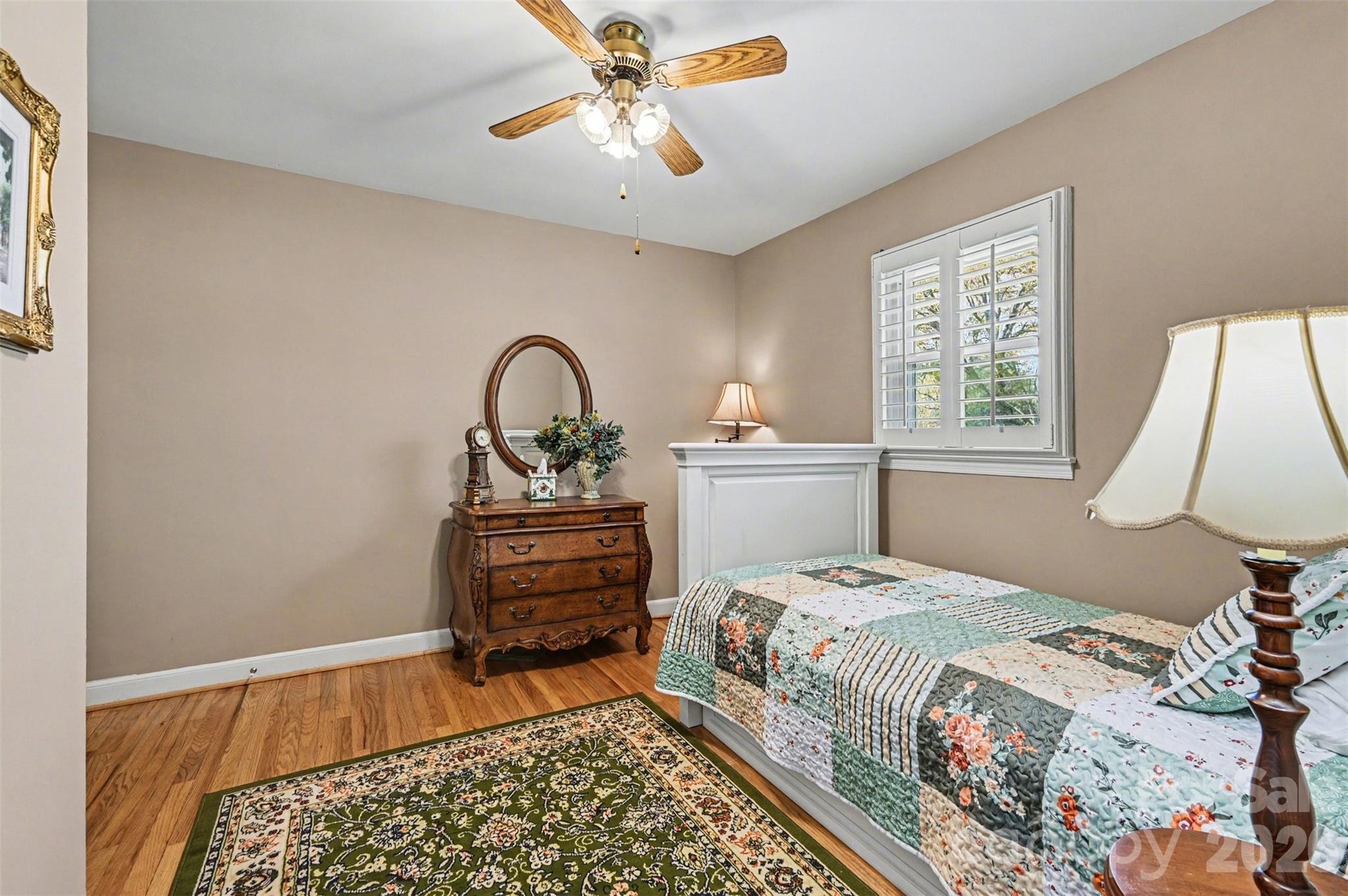 2008 Kings Road Shelby, NC 28150 - Photo 16 of 37 a bedroom with a bed and a lamp on dresser