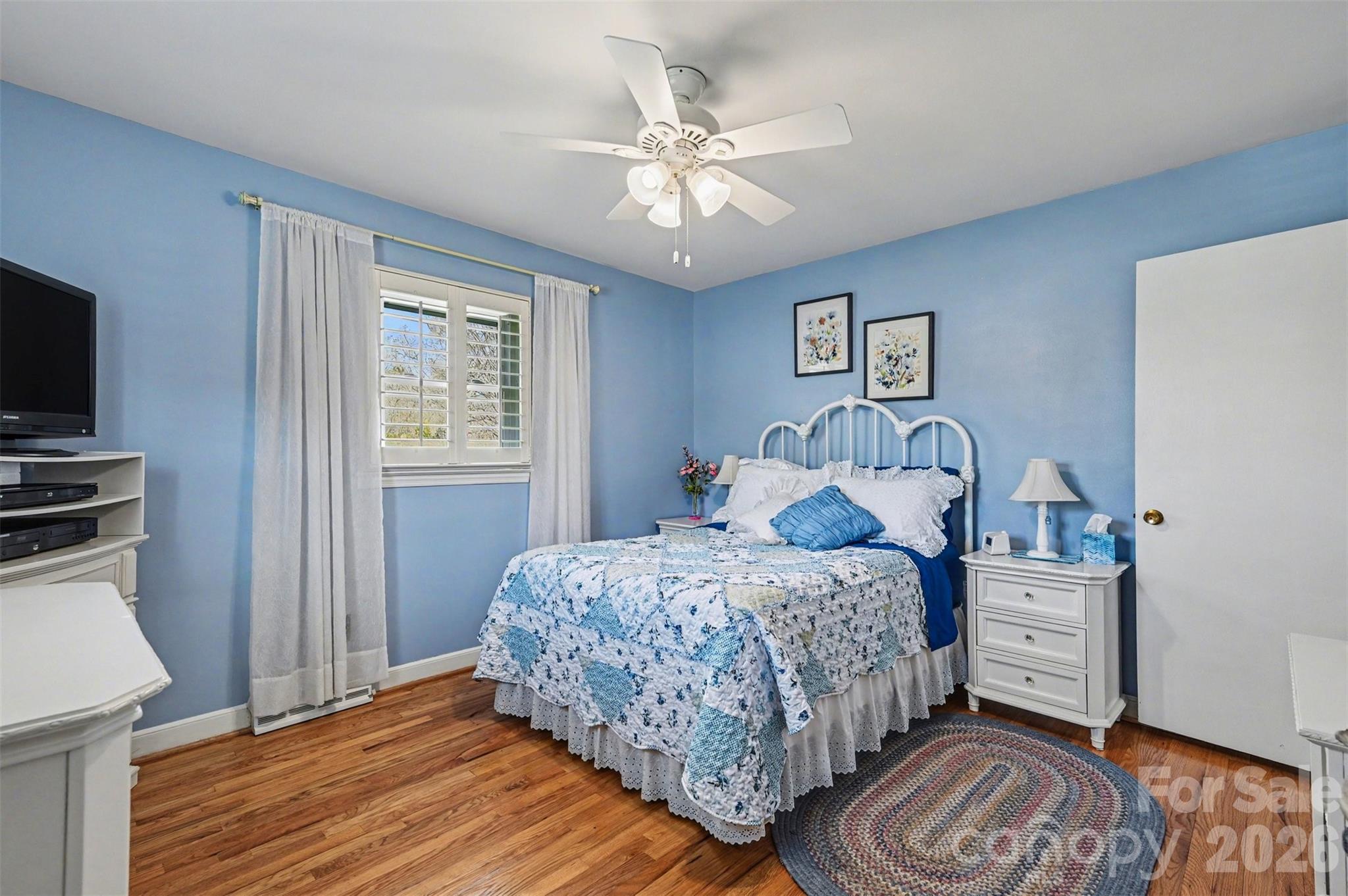 2008 Kings Road Shelby, NC 28150 - Photo 19 of 37 a bedroom with a bed and a chandelier