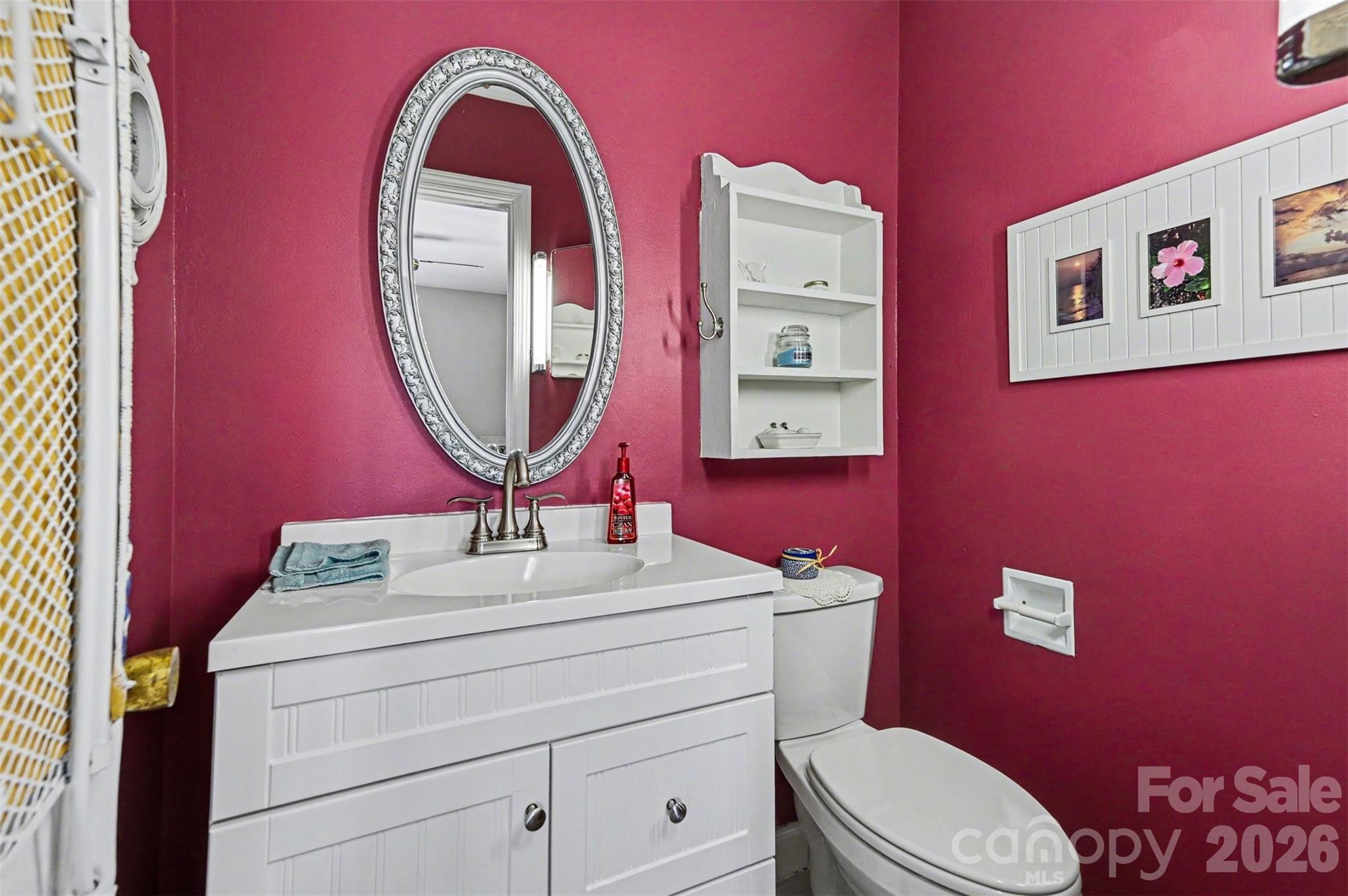 2008 Kings Road Shelby, NC 28150 - Photo 22 of 37 a bathroom with a toilet sink and mirror