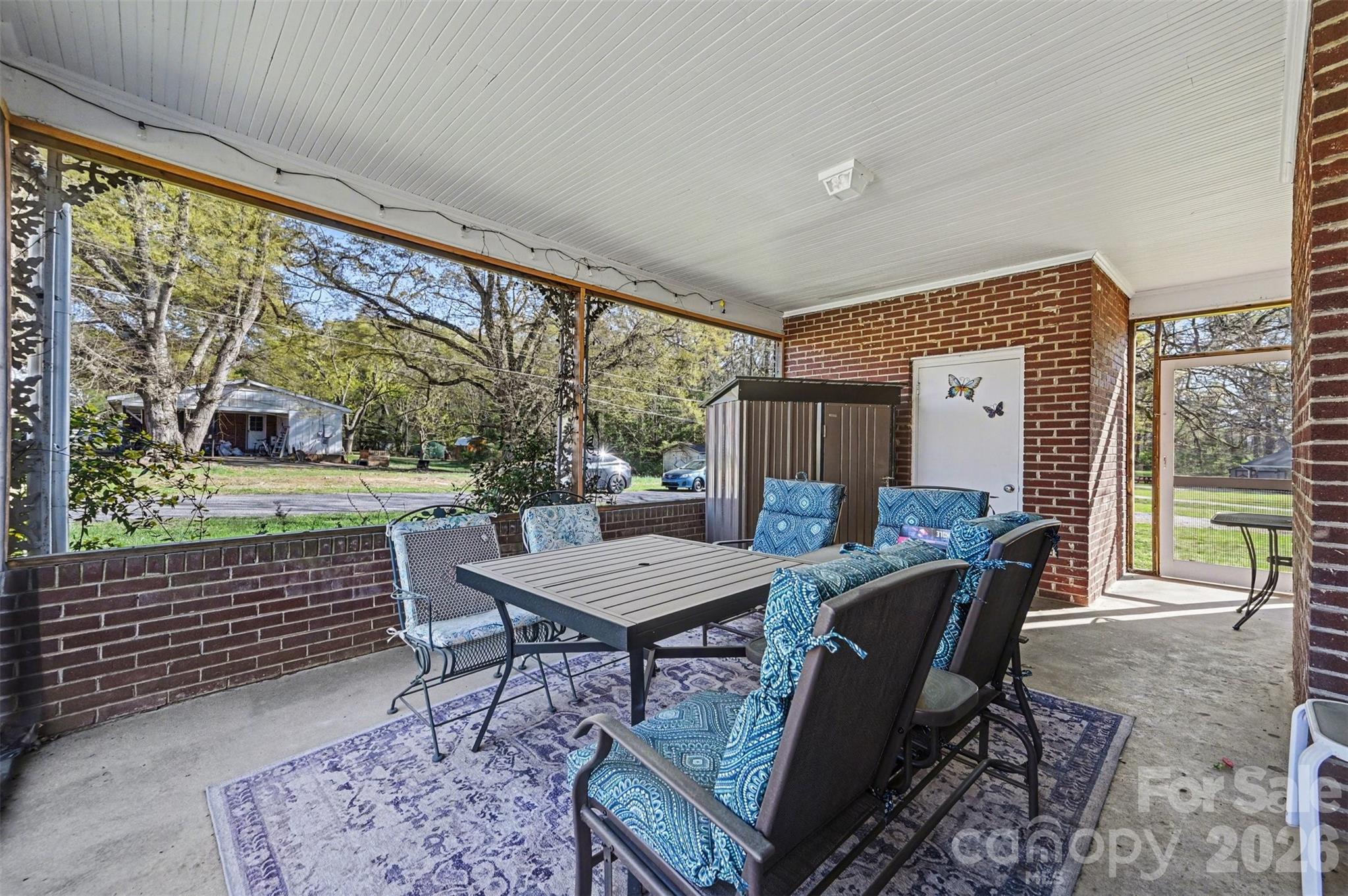 2008 Kings Road Shelby, NC 28150 - Photo 5 of 37 a view of a patio with a dining table and chairs