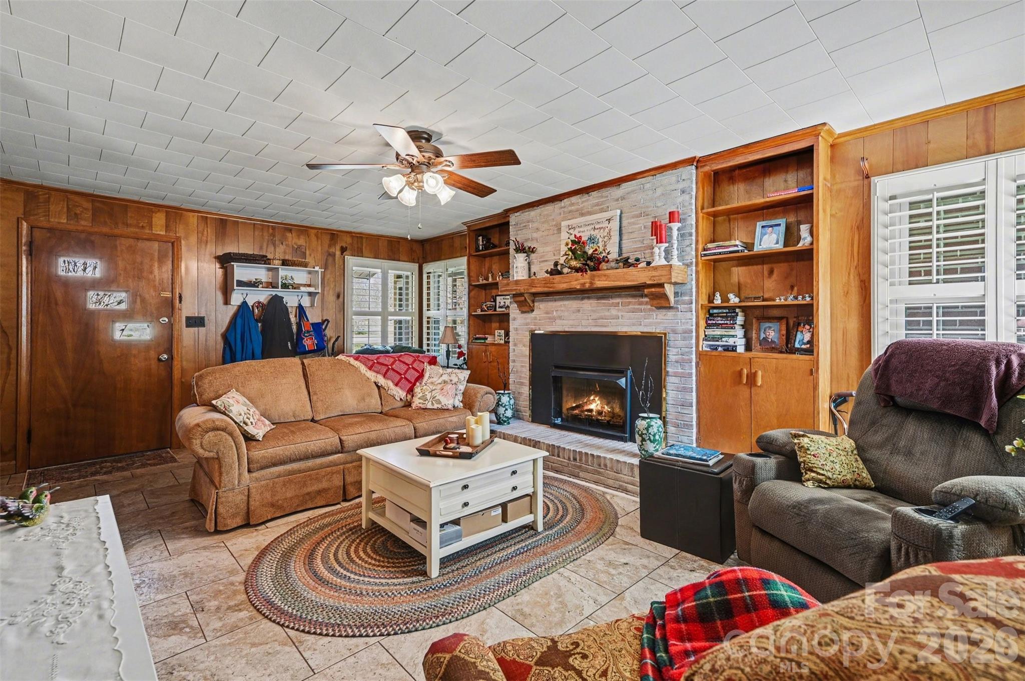2008 Kings Road Shelby, NC 28150 - Photo 6 of 37 a living room with furniture a flat screen tv and a fireplace
