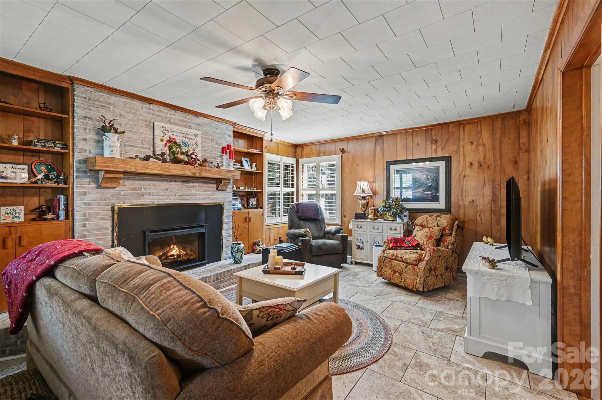 2008 Kings Road Shelby, NC 28150 - Photo 8 of 37 a living room with furniture a fireplace and a window