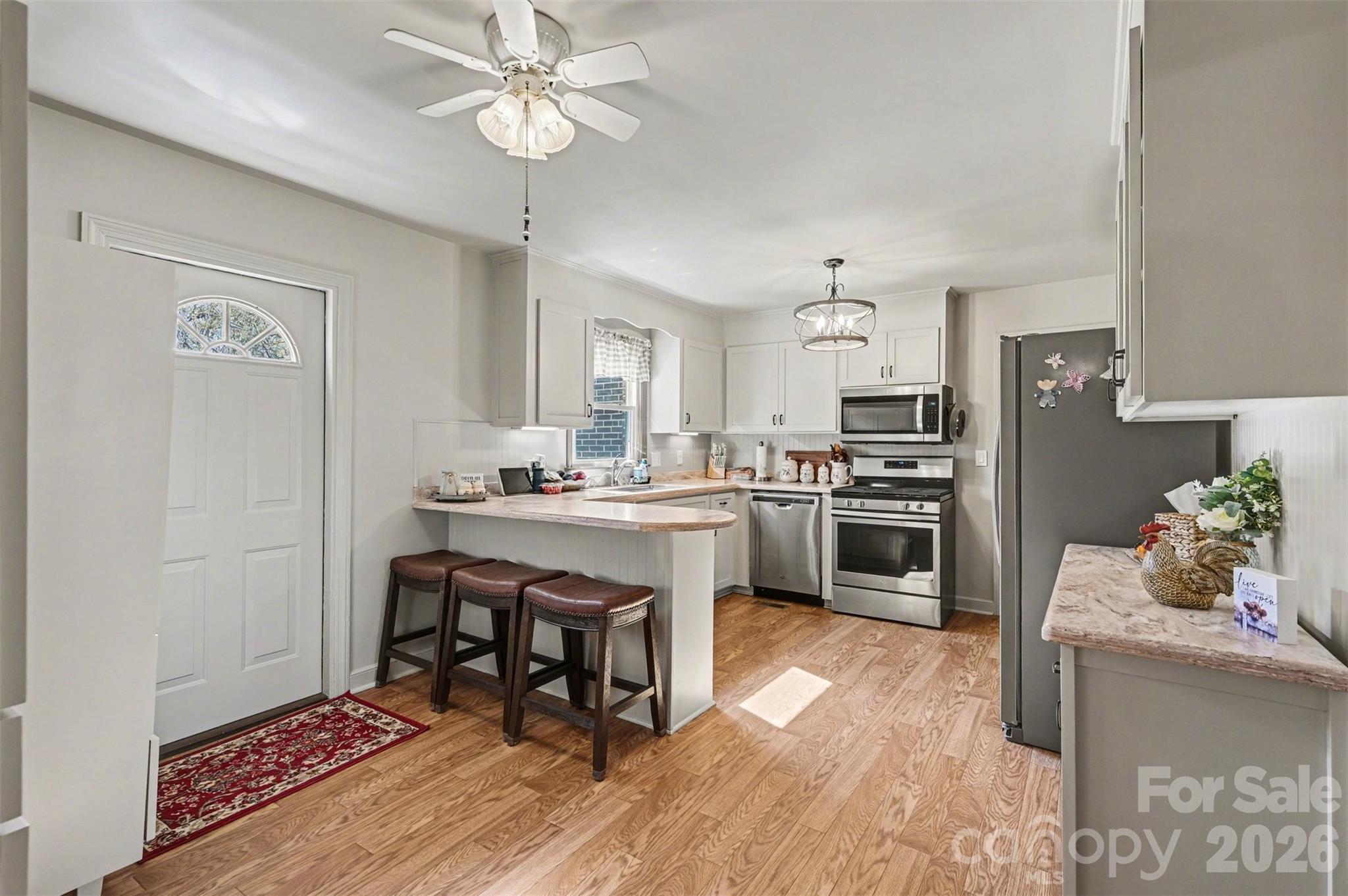 2008 Kings Road Shelby, NC 28150 - Photo 9 of 37 a kitchen with a sink cabinets stainless steel appliances and a dining table