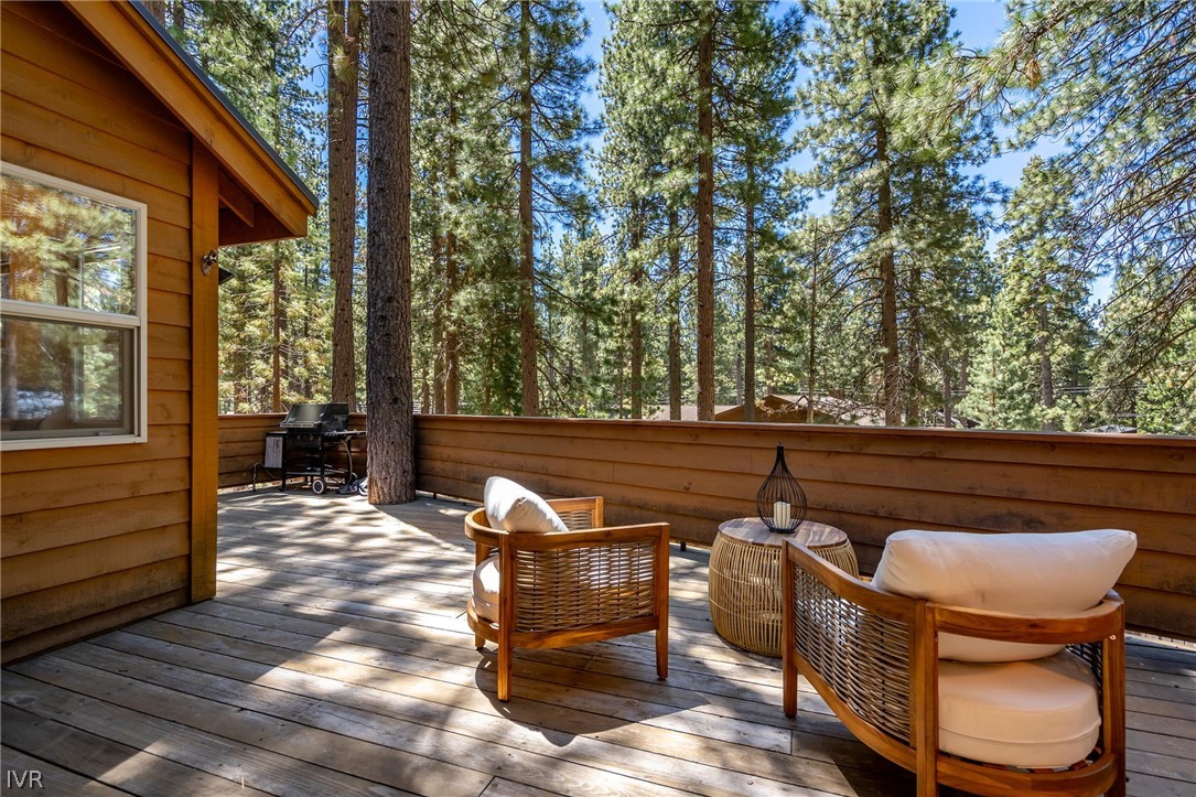 1075 Oxen Road Incline Village, NV 89451 - Photo 11 of 12 a view of a chairs and tables in the back yard of the house