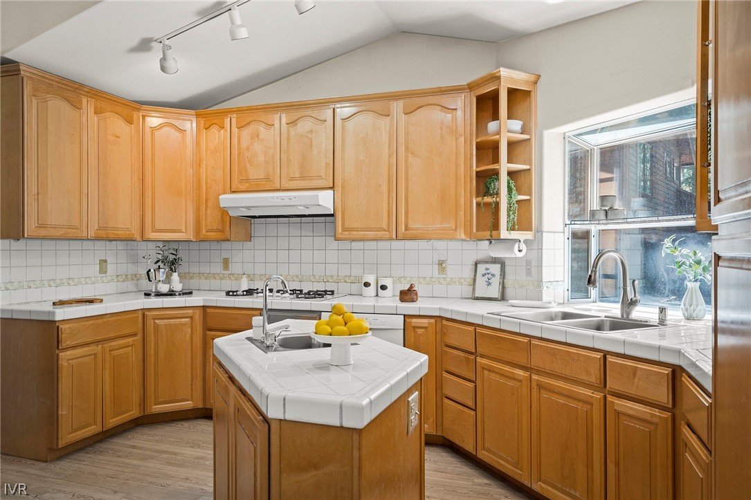 1075 Oxen Road Incline Village, NV 89451 - Photo 6 of 12 a kitchen with a sink stove and cabinets