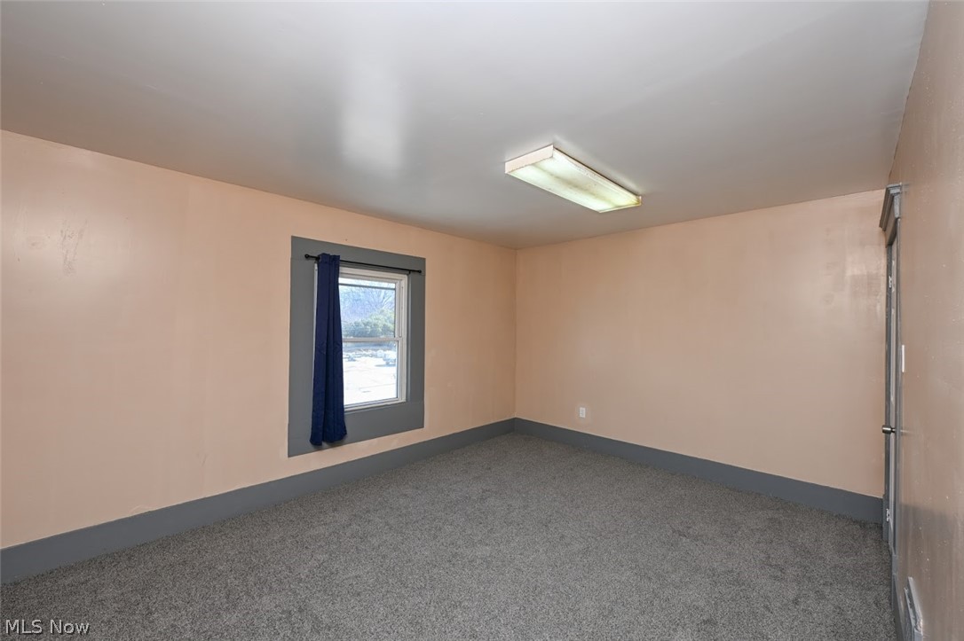 868 North Main Street Akron, OH 44310 - Photo 17 of 30 Carpeted spare room with baseboards