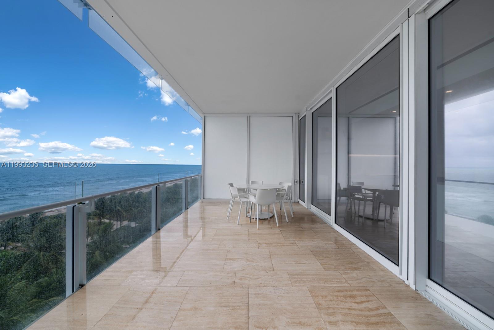 9111 Collins Avenue, Unit N717 Surfside, FL 33154 - Photo 30 of 68 a lobby with furniture and outdoor view