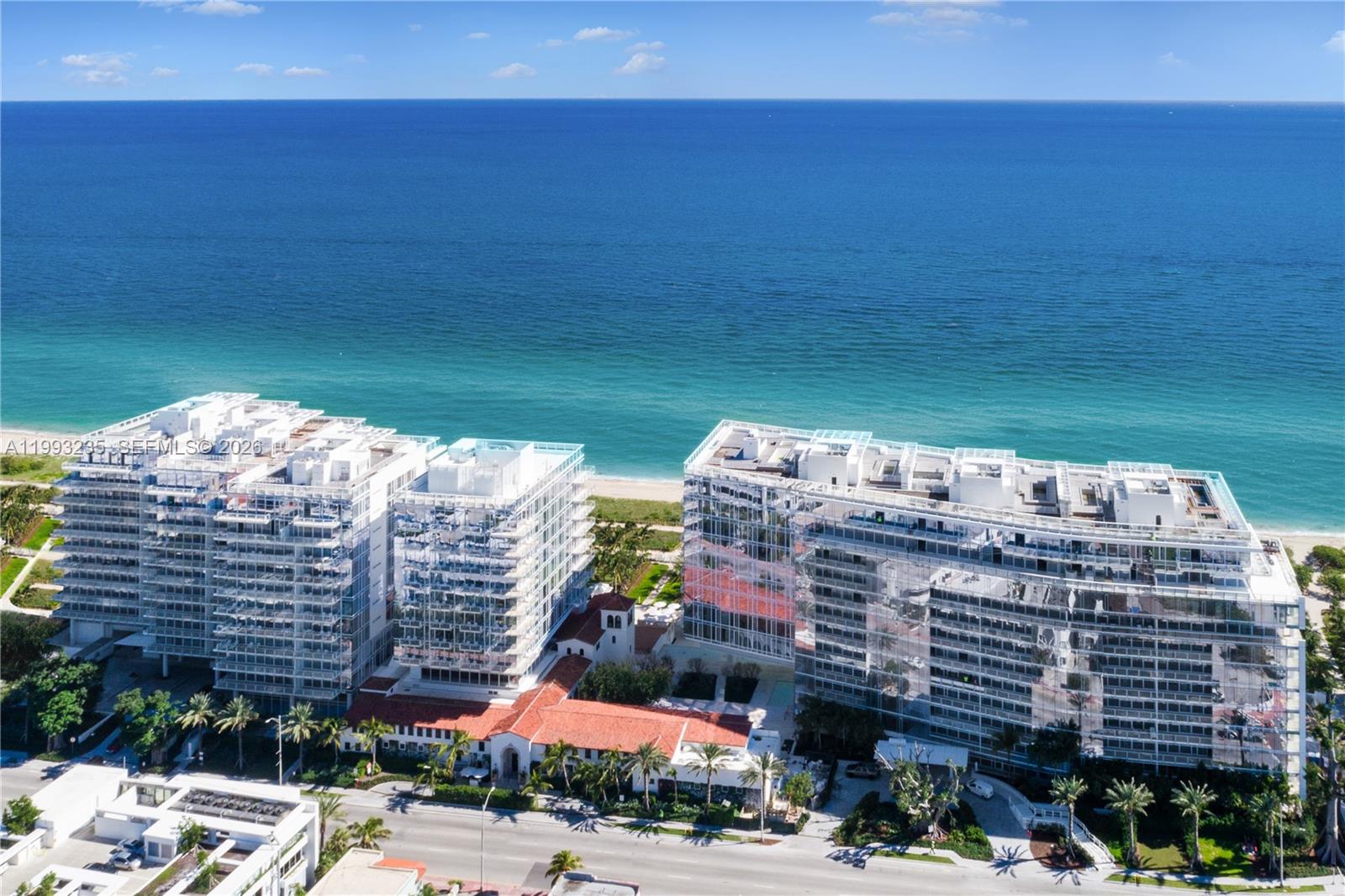 9111 Collins Avenue, Unit N717 Surfside, FL 33154 - Photo 4 of 11 a view of a building with many windows
