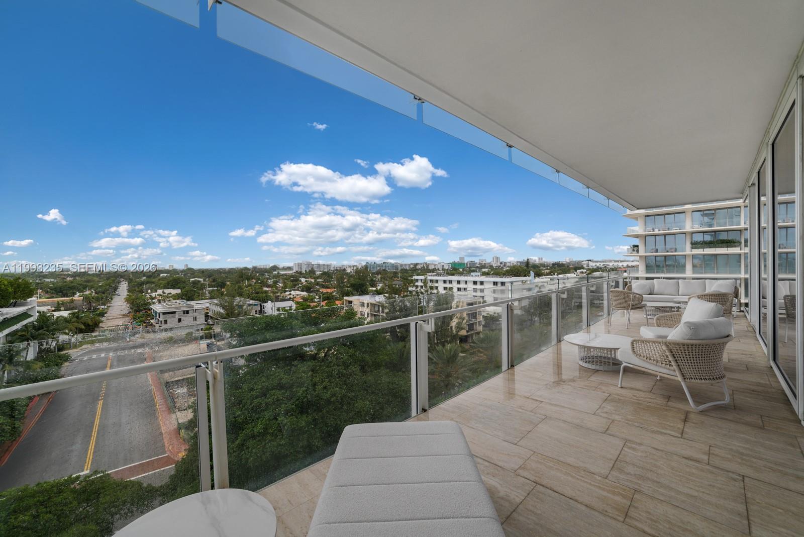 9111 Collins Avenue, Unit N717 Surfside, FL 33154 - Photo 50 of 68 a view of a balcony with a patio