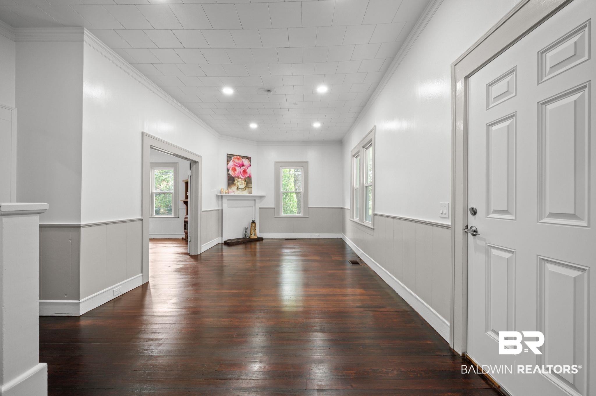733 Pineville Road Monroeville, AL 36460 - Photo 7 of 68 Entrance foyer with crown molding, a wainscoted wall, and hardwood / wood-style floors