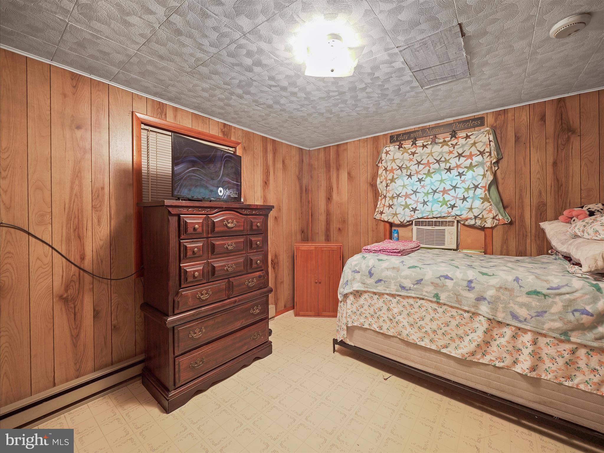 878 Co Rte 2/3 Hedgesville, WV 25427 - Photo 19 of 20 a bedroom with a bed and a dresser