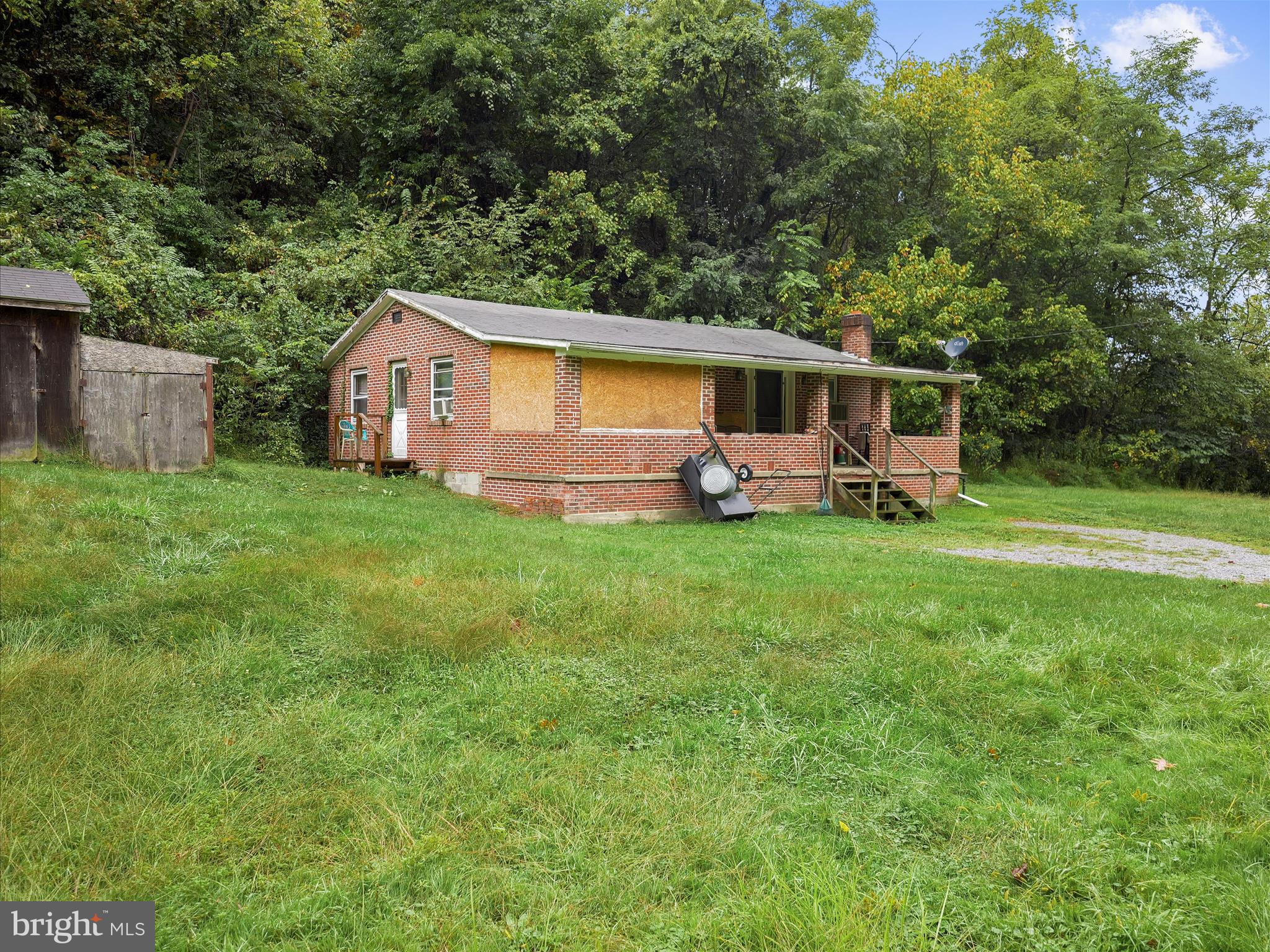 878 Co Rte 2/3 Hedgesville, WV 25427 - Photo 2 of 20 a front view of a house with garden