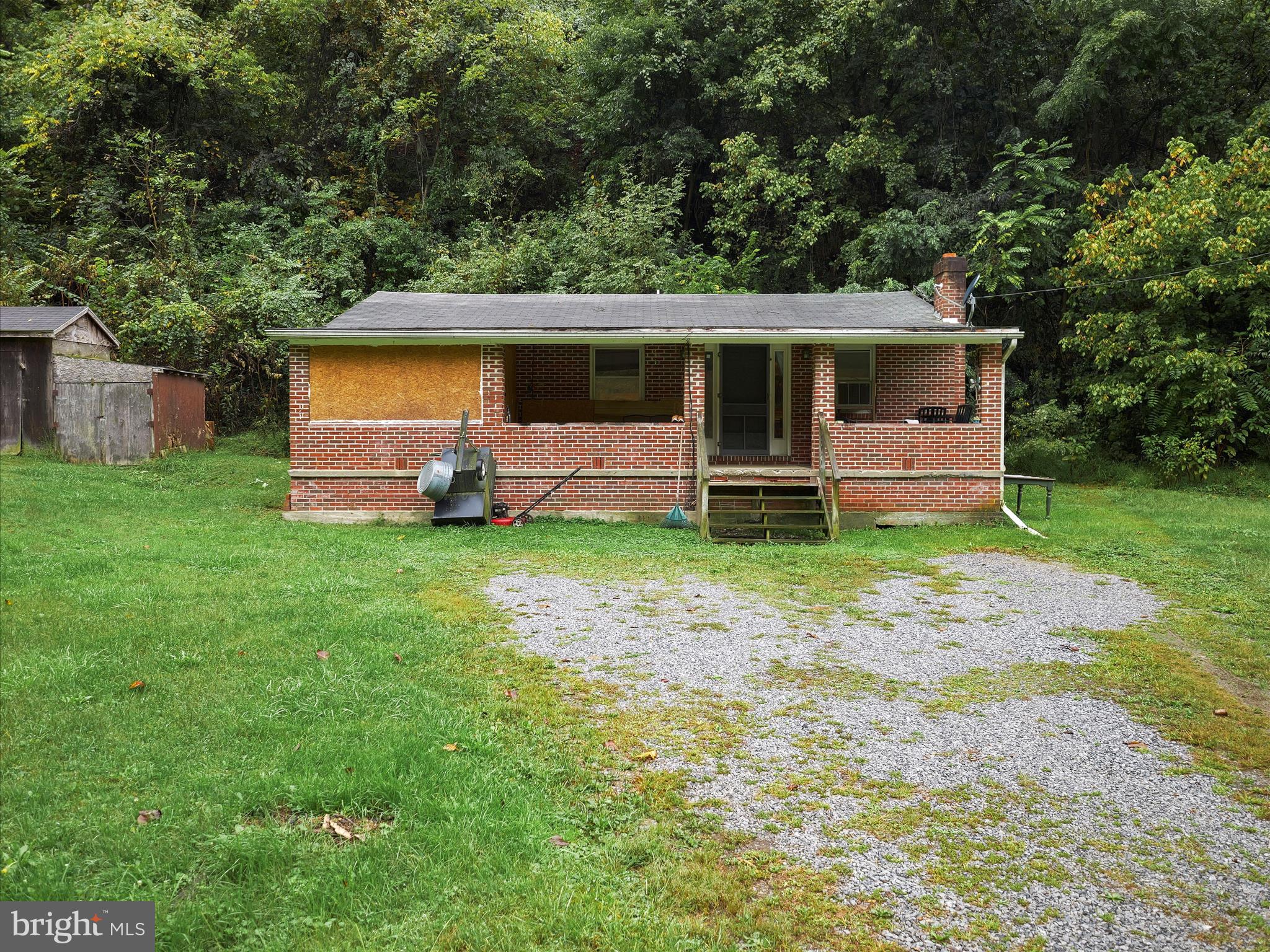878 Co Rte 2/3 Hedgesville, WV 25427 - Photo 4 of 20 a front view of a house with garden