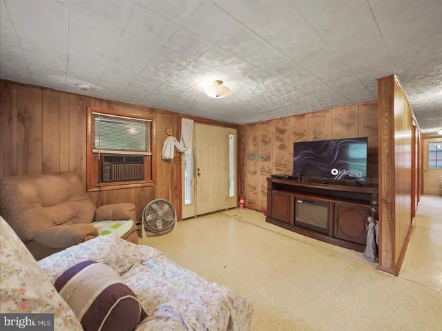 a living room with a couch and a flat screen tv