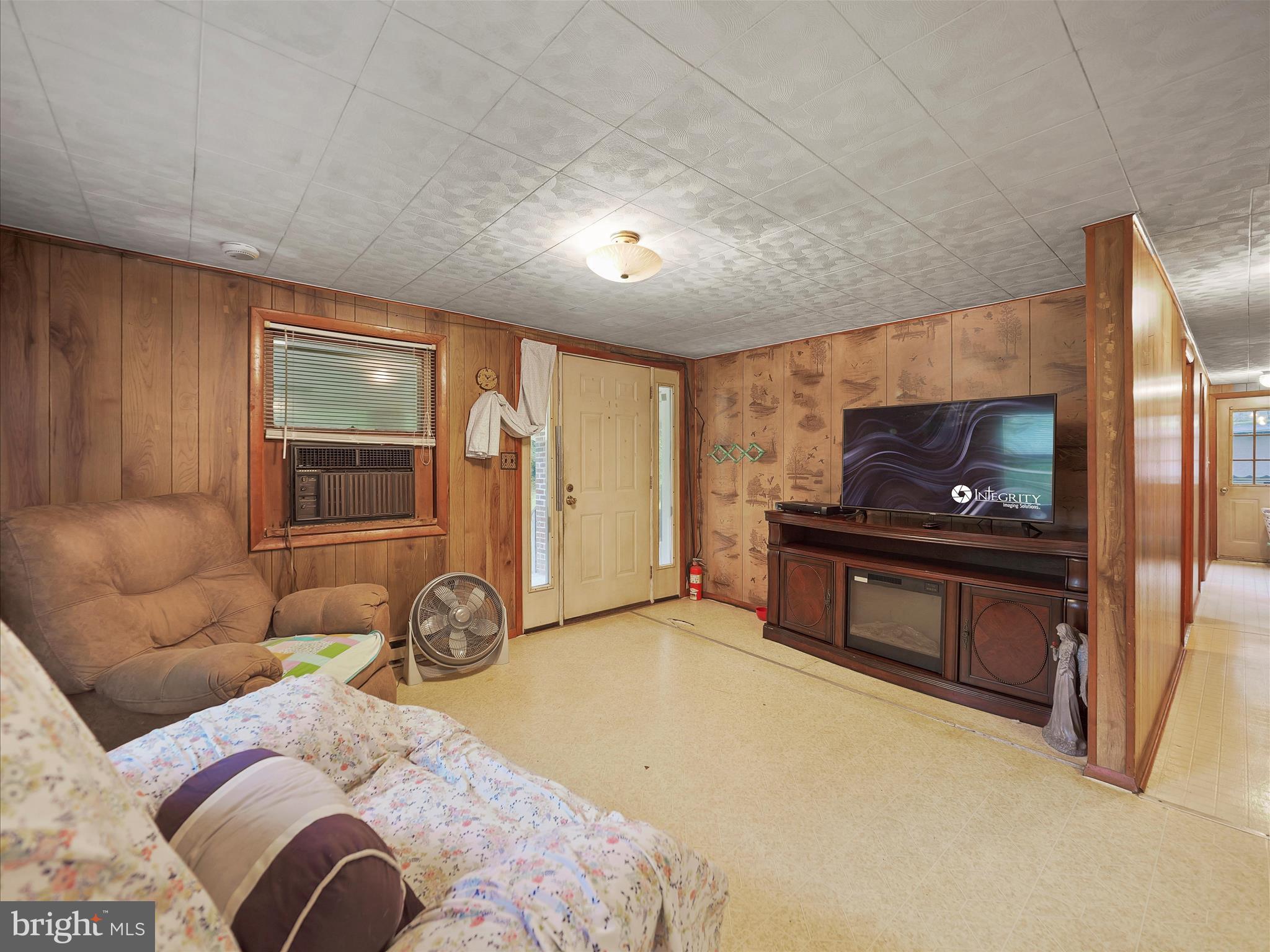 878 Co Rte 2/3 Hedgesville, WV 25427 - Photo 10 of 20 a living room with a couch and a flat screen tv