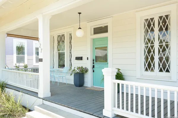 a view of porch with a chair and wooden floor