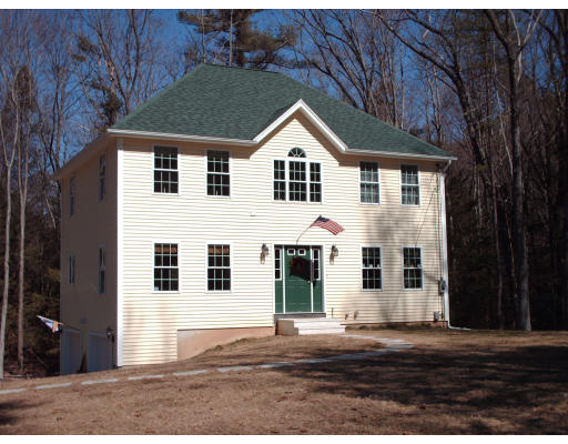 39 Leno Road Holland, MA 01521 - Photo 1 of 7 a view of a white house with large windows