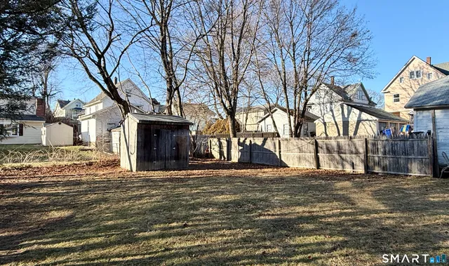 a big house with trees in front of it
