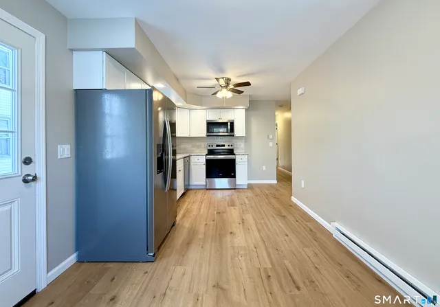 a view of a kitchen from the hallway