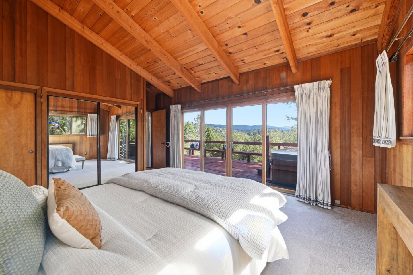 2 No Name Road Los Gatos, CA 95033 - Photo 14 of 37 a large bed sitting in a bedroom next to a window