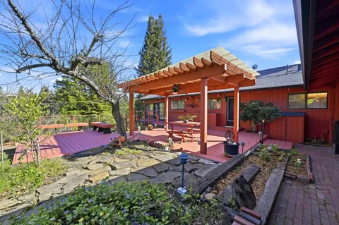 an aerial view of a house with outdoor space