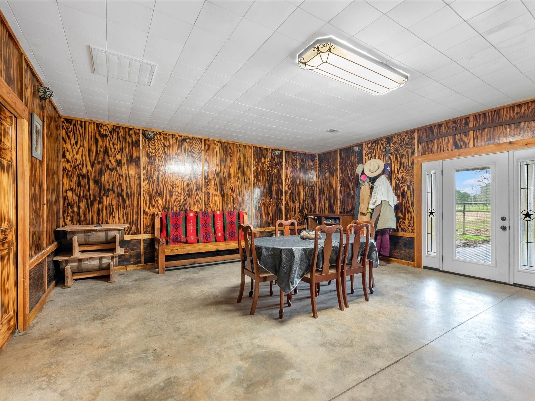 5013 U-Pond Drive Angleton, TX 77515 - Photo 5 of 8 a view of a dining room with furniture window and outside view