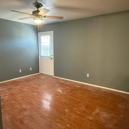 a view of an empty room with a window