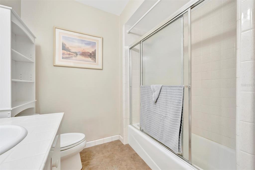 7015 Spears Road Plant City, FL 33567 - Photo 17 of 77 a bathroom with a toilet and a shower