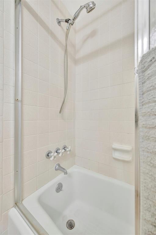 7015 Spears Road Plant City, FL 33567 - Photo 18 of 77 a white bath tub sitting next to a white sink and a shower