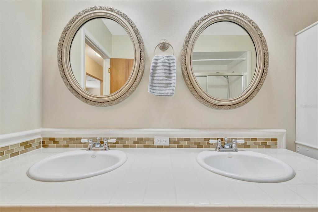 7015 Spears Road Plant City, FL 33567 - Photo 19 of 77 a bathroom with a granite countertop and a mirror