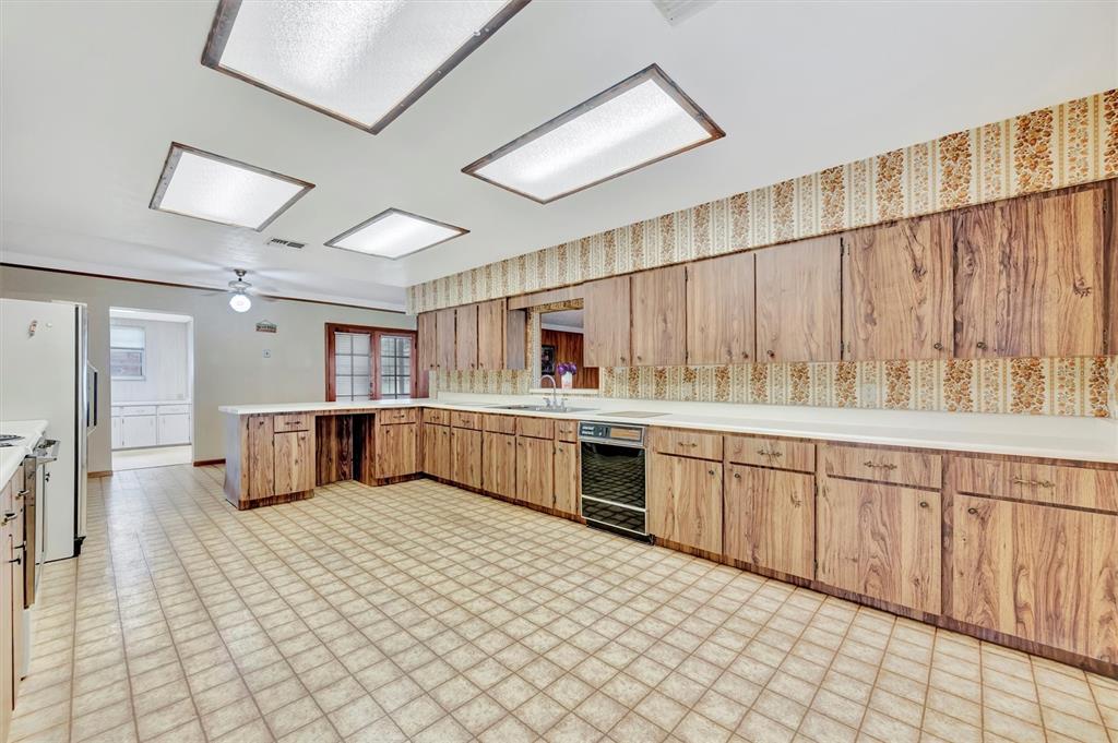7015 Spears Road Plant City, FL 33567 - Photo 27 of 77 a kitchen with stainless steel appliances a sink and cabinets