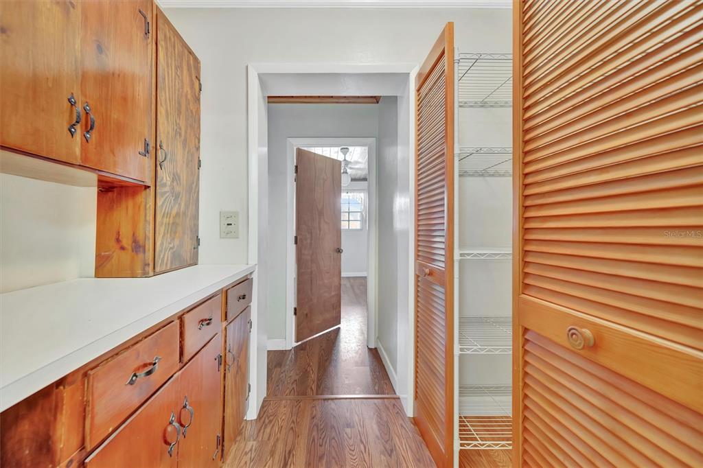 7015 Spears Road Plant City, FL 33567 - Photo 29 of 77 a view of hallway with mirror and wooden floor